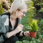Woman gardening with plant